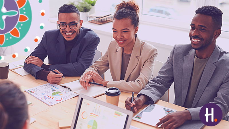 A group of people in a meeting discussing why investing in employees benefits is good business